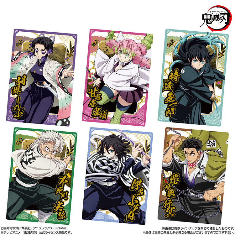 Demon Slayer Wafer Vol.10 featuring collectible anime cards and chocolate wafer packaging with Tanjiro, Nezuko, and other characters.