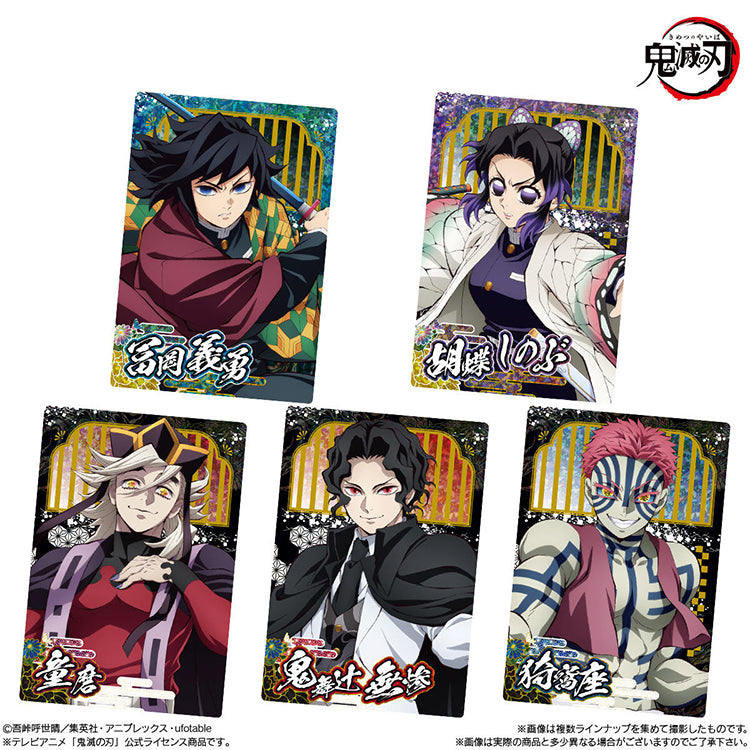 Demon Slayer Wafer Vol.10 featuring collectible anime cards and chocolate wafer packaging with Tanjiro, Nezuko, and other characters.