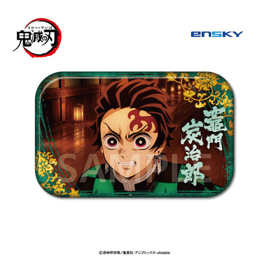 Close-up of the Tanjiro Demon Slayer Marukaku can badge, gritting his teeth in a wooden hall, green border with gold florals