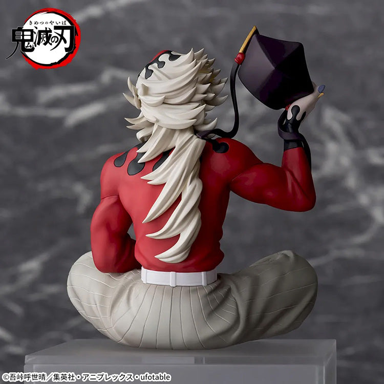 Demon Slayer Doma Premium Perching Figure sitting on a shelf edge with detailed sculpt and vivid colors.