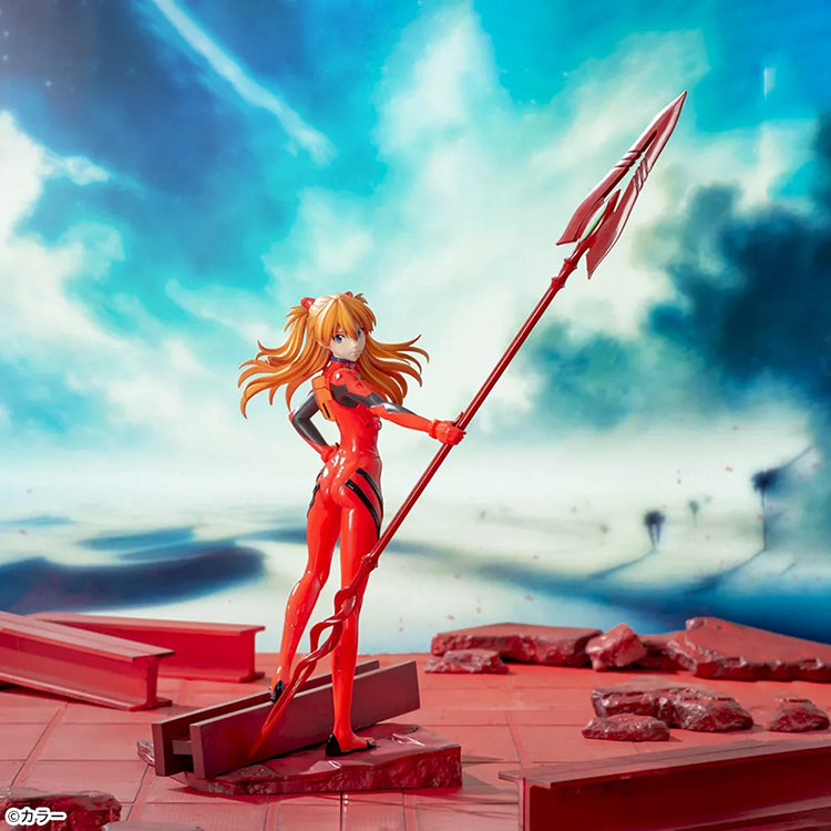 Shin Evangelion Theatrical Version Luminasta figure of Asuka Langley Shikinami wearing a glossy red plugsuit, standing in a dynamic pose while holding the large Spear of Cassius. The figure is displayed on a red base with a marble-like background.