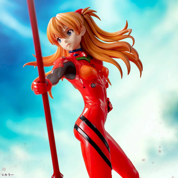 Shin Evangelion Theatrical Version Luminasta figure of Asuka Langley Shikinami wearing a glossy red plugsuit, standing in a dynamic pose while holding the large Spear of Cassius. The figure is displayed on a red base with a marble-like background.