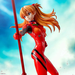 Shin Evangelion Theatrical Version Luminasta figure of Asuka Langley Shikinami wearing a glossy red plugsuit, standing in a dynamic pose while holding the large Spear of Cassius. The figure is displayed on a red base with a marble-like background.