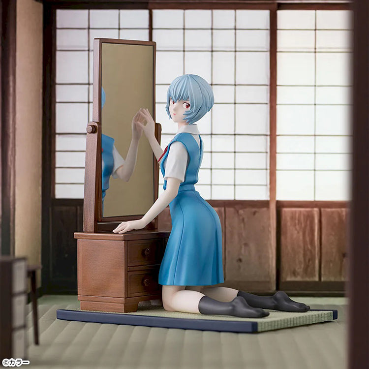 Rei Ayanami FIGURIZMα SEGA figure kneeling by a wooden vanity from Evangelion: 3.0+1.0 Thrice Upon a Time.