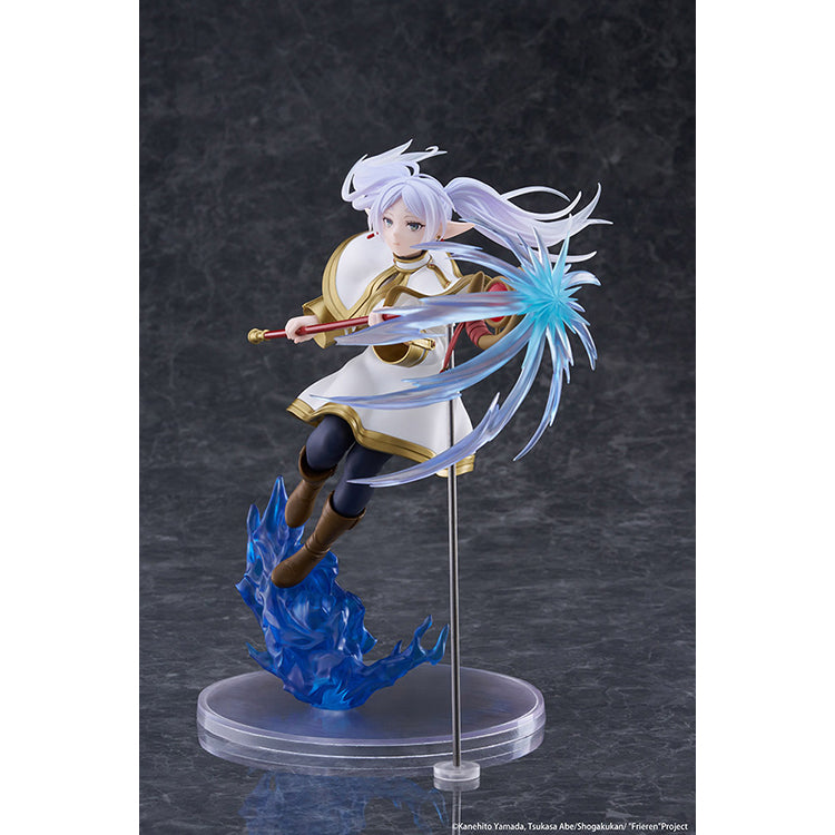 Frieren AMP+ Figure from Frieren: Beyond Journey’s End by Taito, dynamic battle pose with flowing cloak and detailed sculpt.