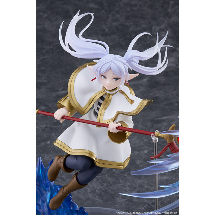 Frieren AMP+ Figure from Frieren: Beyond Journey’s End by Taito, dynamic battle pose with flowing cloak and detailed sculpt.