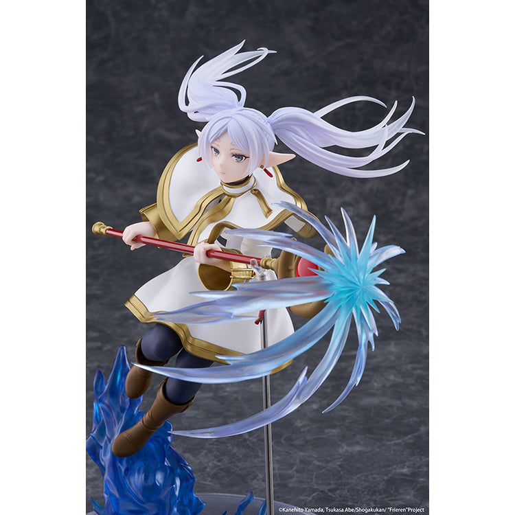 Frieren AMP+ Figure from Frieren: Beyond Journey’s End by Taito, dynamic battle pose with flowing cloak and detailed sculpt.