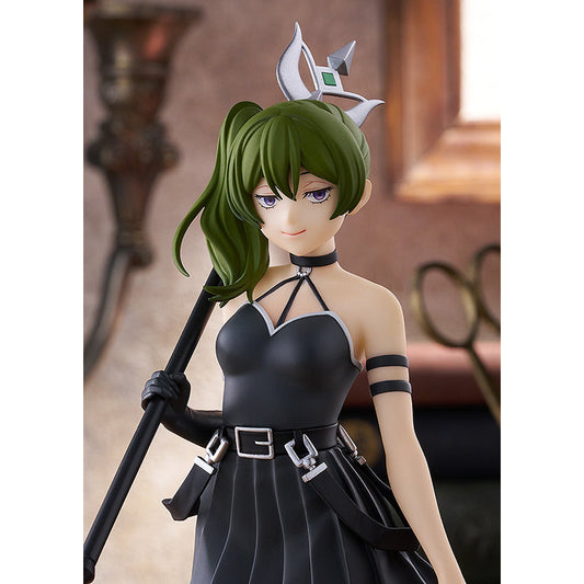 Close-up of Übel's face and upper body on the Frieren POP UP PARADE figure, gloved hand on staff, warm study backdrop