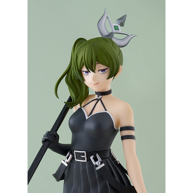 Close-up of Übel's face on the Frieren POP UP PARADE figure, violet eyes and soft smile against a sage green backdrop