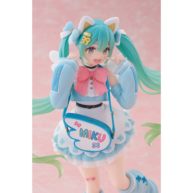 Three-quarter view of the Hatsune Miku Fashion Series figure showing the detailed sculpting of her cat ears, cat tail, and small white wings.
