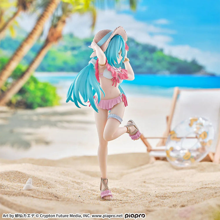 Back view of SEGA Hatsune Miku Tropical Ver. figure with teal gradient twin-tails and pink bikini bows