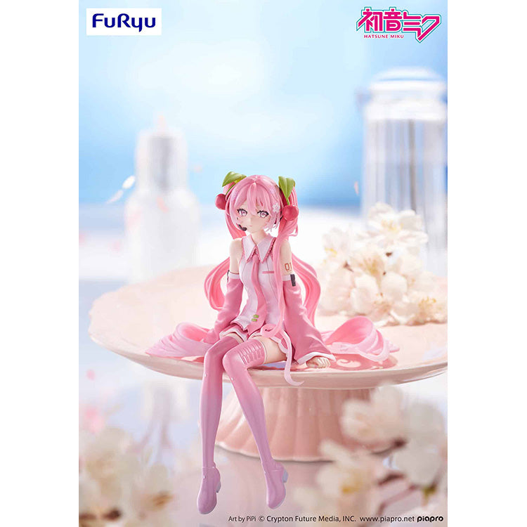FuRyu Sakura Miku 2026 Ver. Noodle Stopper Figure in pink cherry blossom outfit perched on a display rim.