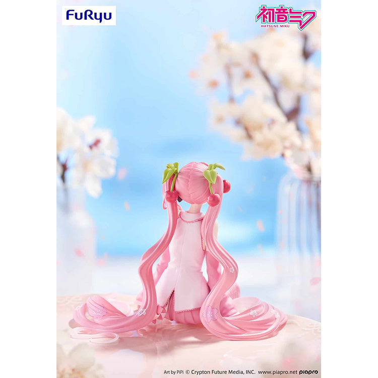Sakura Miku 2026 Noodle Stopper Figure by FuRyu showing back view of pink twintails and cherry blossom hair accessories.
