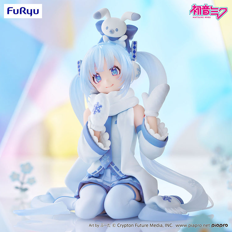 Side angle of the Snow Miku Noodle Stopper figure showing the detail of her long flowing hair and winter boots