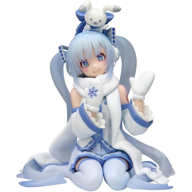 FuRyu Snow Miku Sky Town 10th Anniversary Noodle Stopper figure kneeling in a white and blue winter outfit with a rabbit on her head.