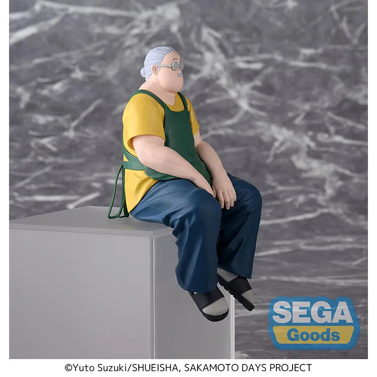 SEGA Sakamoto Days Taro Sakamoto Chokonose Figure, sitting store manager version with green apron and glasses.
