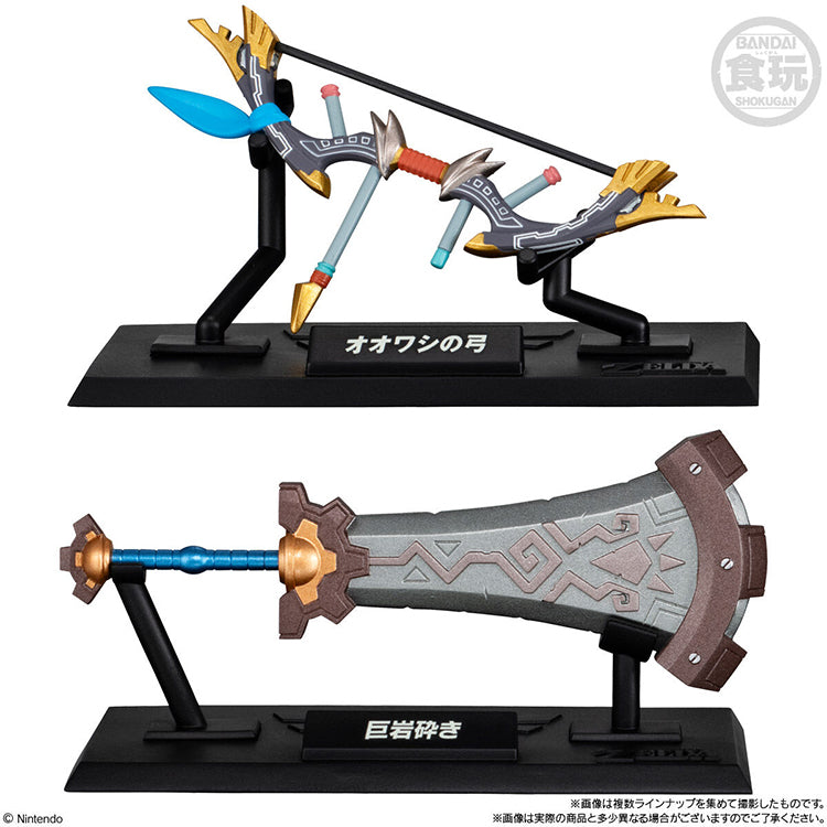 Bandai Legend of Zelda weapon miniatures featuring the Great Eagle Bow and Boulder Breaker on logo display stands.